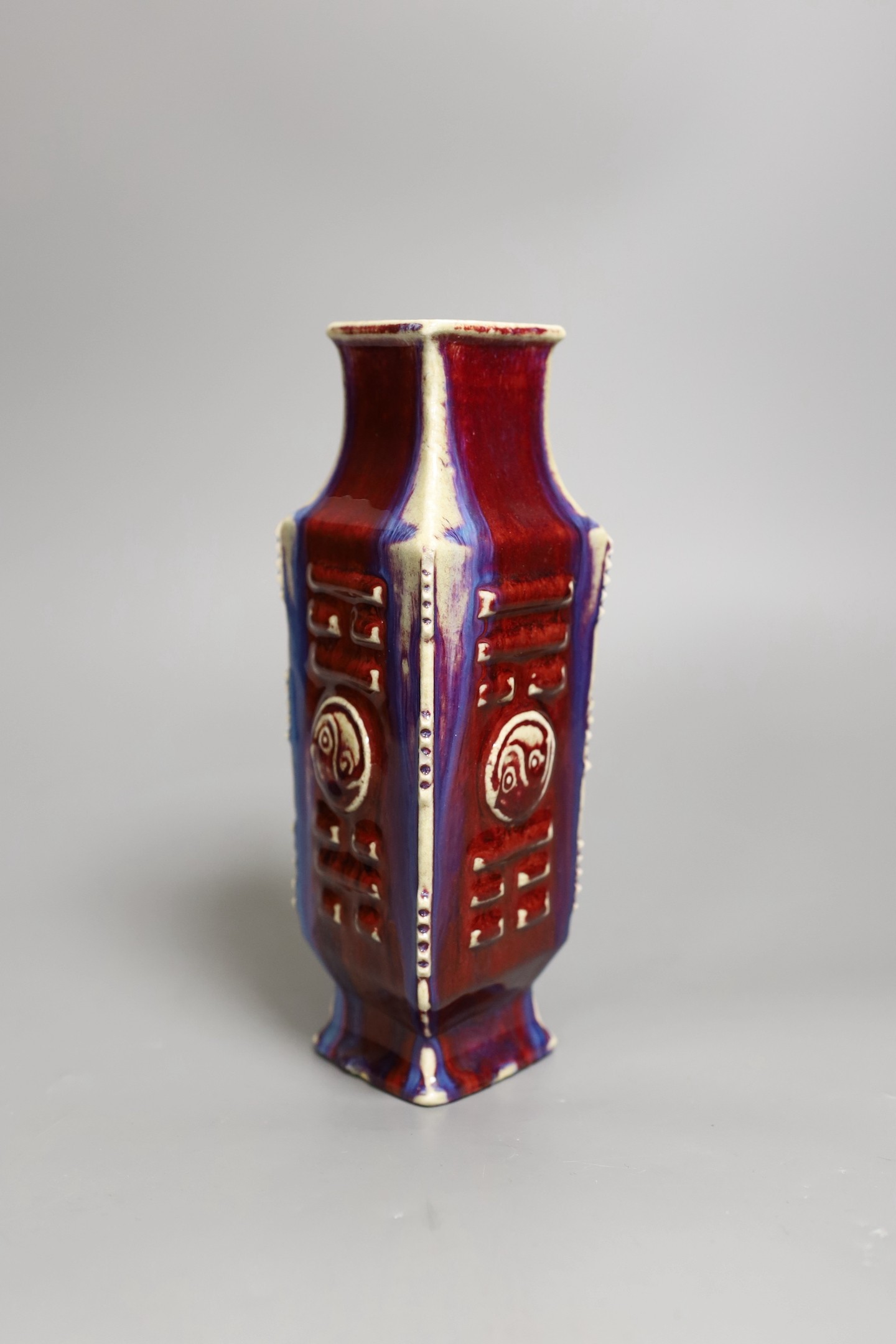A Chinese flambe ‘eight trigrams’ lozenge section vase, late 19th / early 20th century, 22cm tall